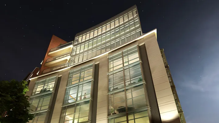 Dusk view of The Darcy with ambient lighting highlighting building features