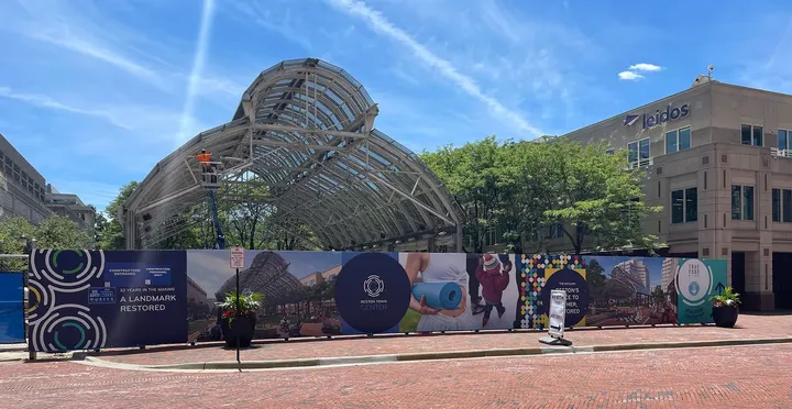 Long pavilion banner stretching across Reston Town Center construction site