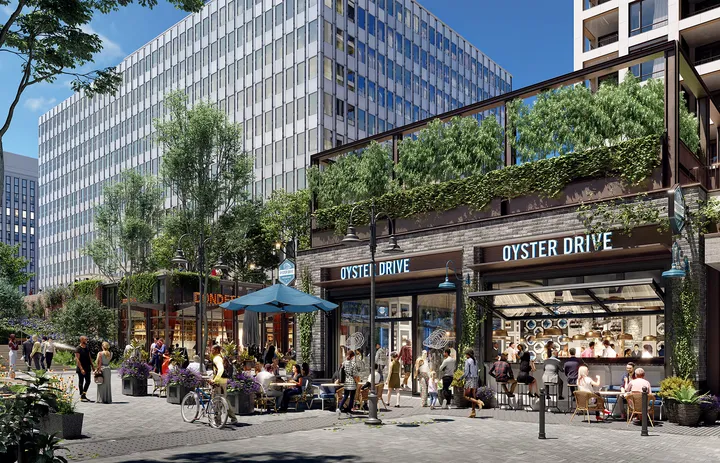 Street level view of retail spaces at 1900 Crystal Drive with pedestrian activity