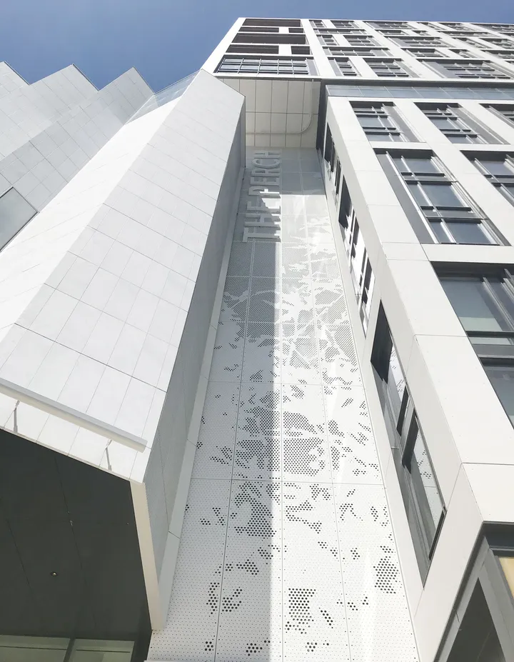 The Perch architectural signage and dimensional branding elements on building