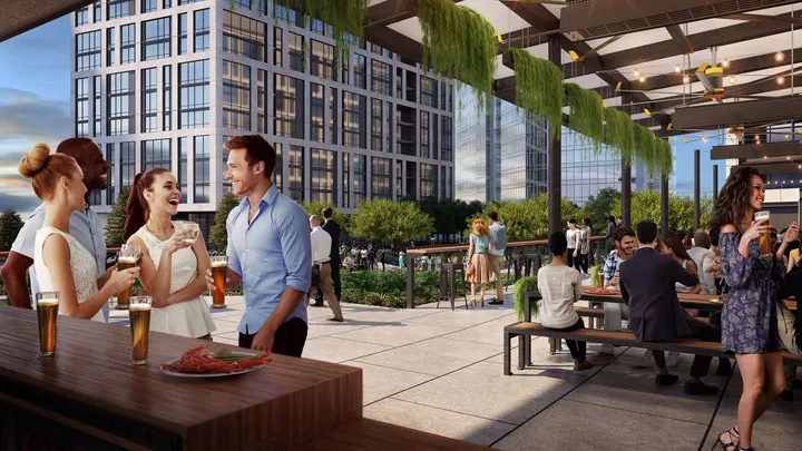 The Perch biergarten area with outdoor seating and landscaping on rooftop