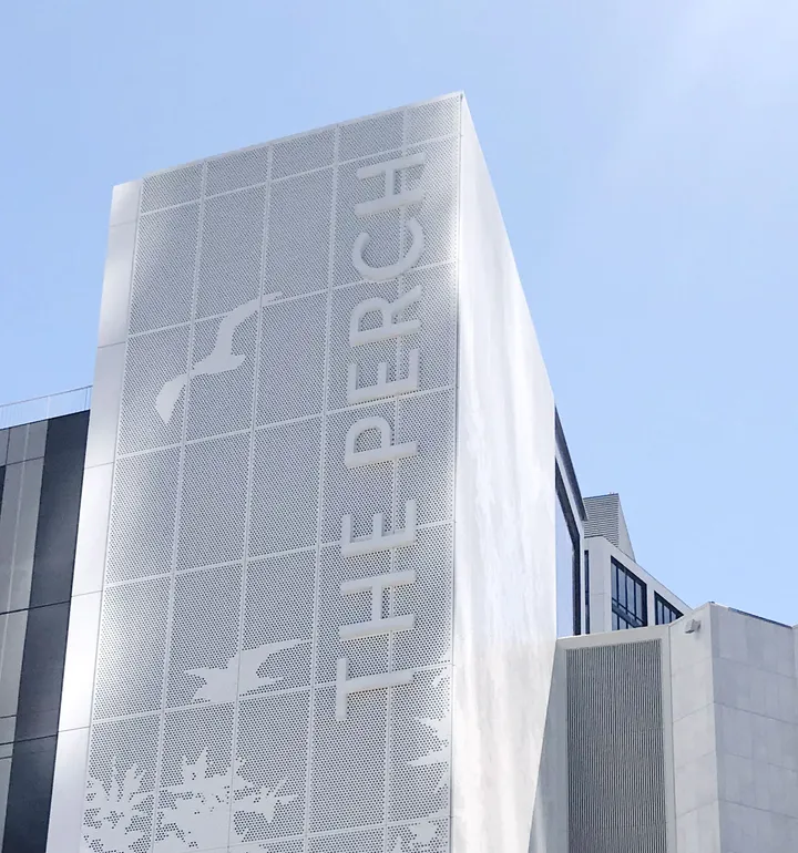 Second view of The Perch exterior branding showing wayfinding and signage system