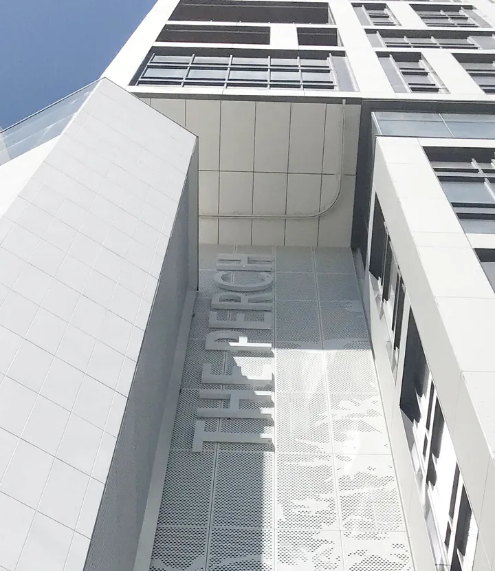 Close-up of The Perch exterior branding and environmental graphics