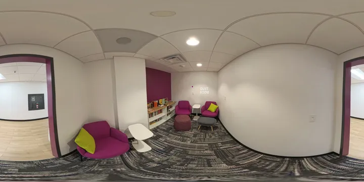 360-degree view of the quiet room, a participant lounge space with seating and a small bookshelf.