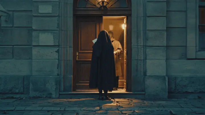 A cloaked messenger arrives at a lit doorway